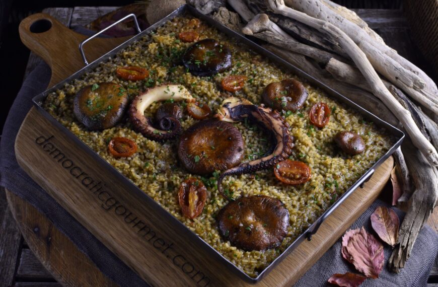dry rice (paella) with octopus, lactarius mushrooms and cherry tomatoes