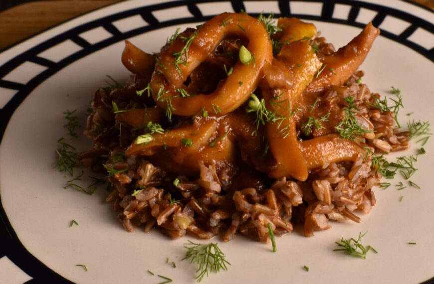 camargue red rice with squid and orange scented tomato sauce