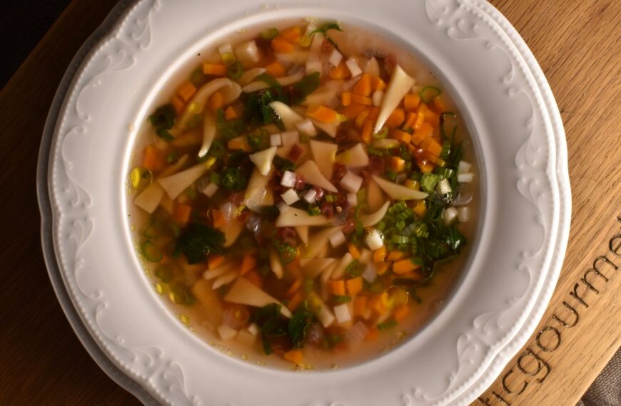 Clear minestrone soup with fresh maltagliatini