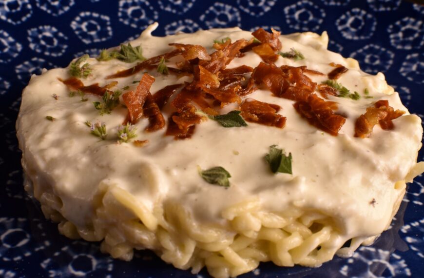 fresh tagliolini with parmesan cream and crunchy prosciutto