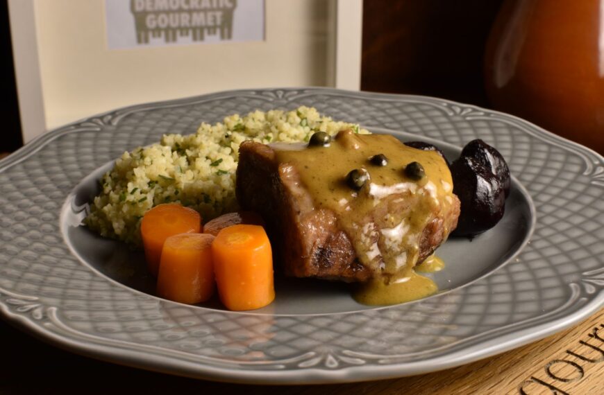 pork neck with mustard sauce, steamed roots and bulgur